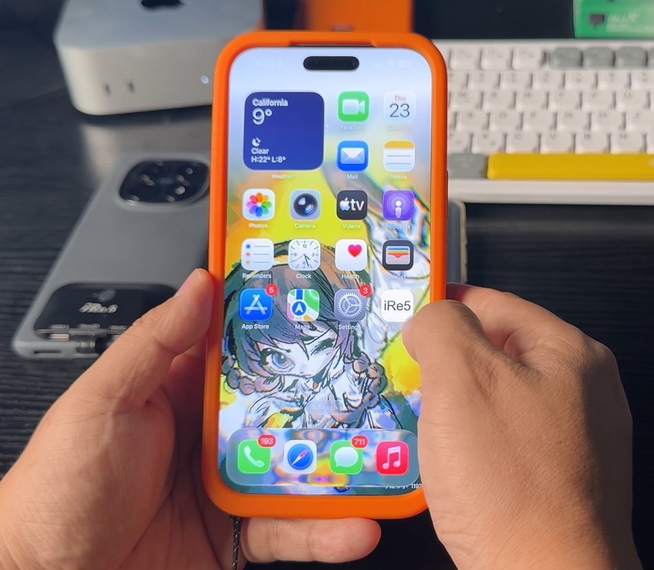 Creator using an iPhone fitted with the orange iRe5 Storage Case
